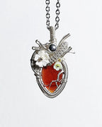 Handmade garnet crystal heart wire wrapped necklace with natural red crystal pendant, symbolizing passion, strength, love, and emotional healing.