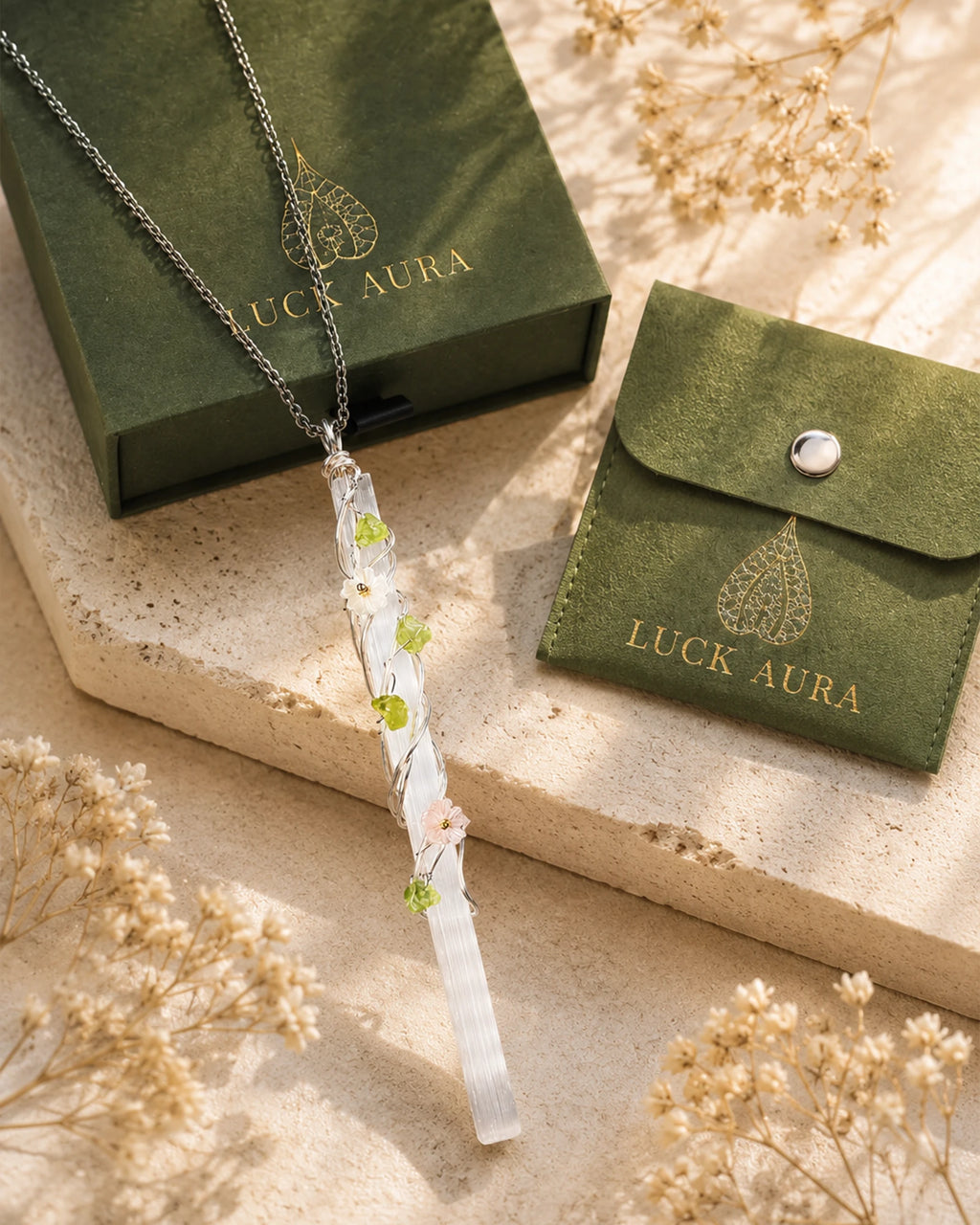 Handmade selenite garden wire wrapped necklace displayed with LuckAura gift packaging, dried flowers, and soft natural light as a meaningful jewelry gift.