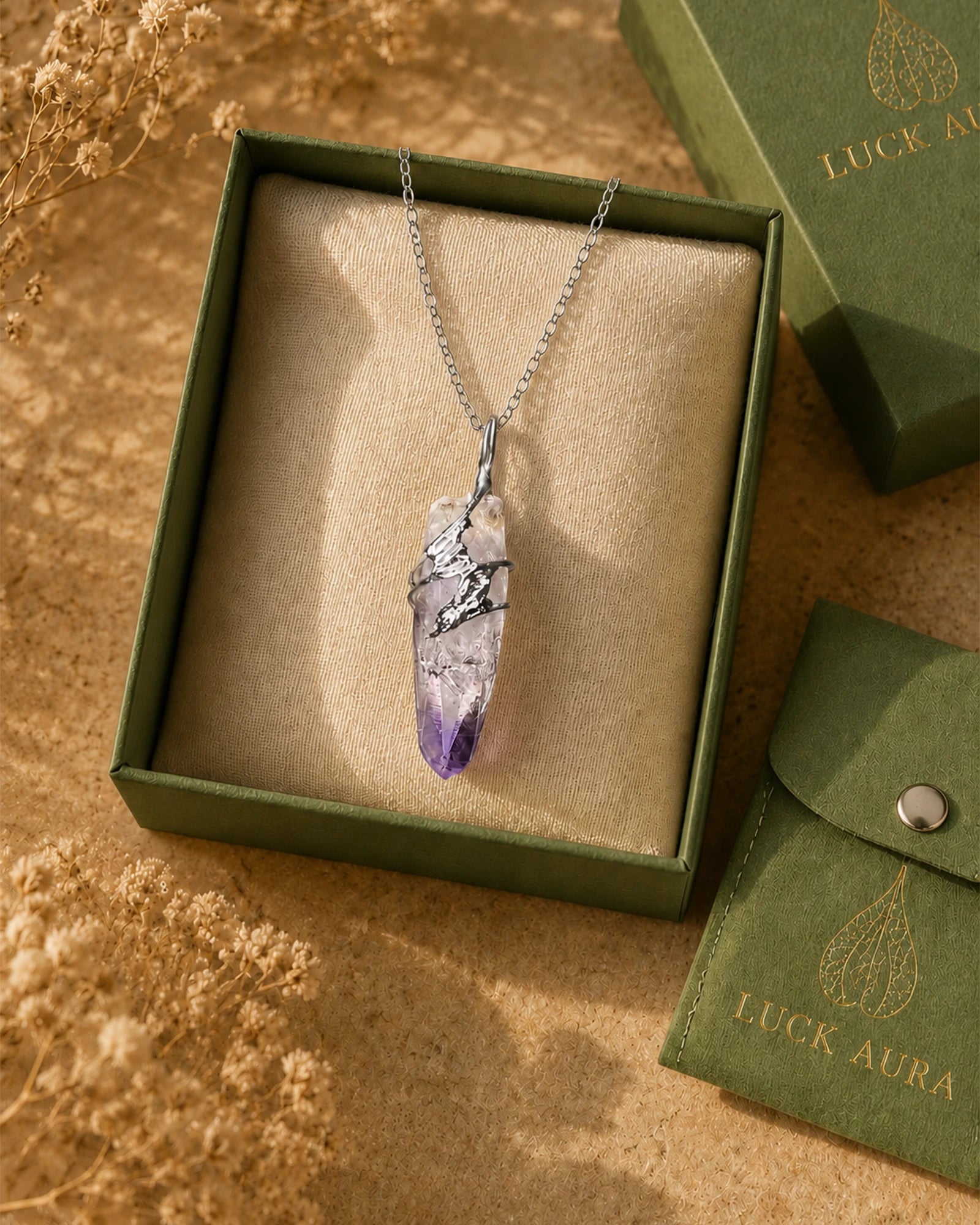 Handmade Cruz amethyst soldered pendant necklace displayed with LuckAura gift packaging, dried flowers, and soft natural light as a meaningful jewelry gift.