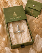 Handmade Lemurian quartz sword pendant necklace displayed with LuckAura gift packaging, dried flowers, and soft natural light as a meaningful jewelry gift.