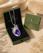 Handmade crystal heart wire wrapped necklace displayed with LuckAura gift packaging, dried flowers, and soft natural light as a meaningful jewelry gift.