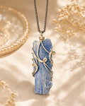 Handmade natural kyanite wire wrapped necklace symbolizing alignment, communication, and inner harmony.