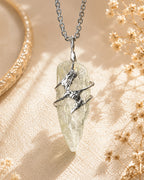 Handmade green crystal soldered pendant necklace with natural pale green crystal, symbolizing growth, renewal, and abundance.