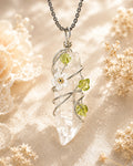 Handmade clear quartz garden wire wrapped necklace with natural crystal pendant and floral details, symbolizing clarity and spiritual growth.