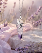 Cruz amethyst soldered pendant necklace styled in a calm natural setting with soft light, botanical details, and a peaceful handmade crystal jewelry aesthetic.