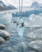 Glacial blue crystal necklace styled in a calm natural setting with soft light, stone textures, and a peaceful handmade crystal jewelry aesthetic.