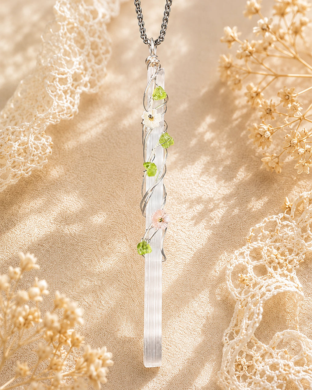 Handmade selenite garden wire wrapped necklace with natural crystal pendant and floral details, symbolizing clarity and peaceful energy.