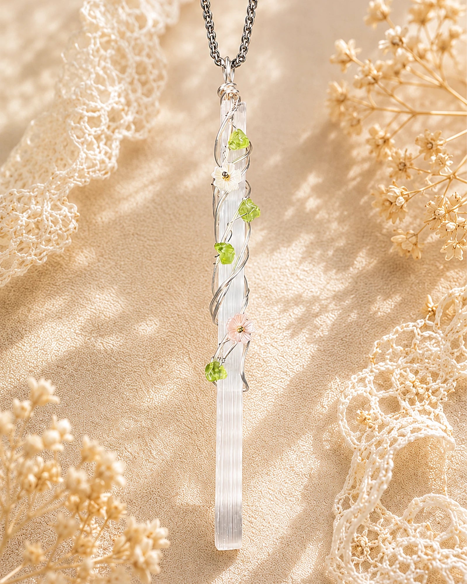 Handmade selenite garden wire wrapped necklace with natural crystal pendant and floral details, symbolizing clarity and peaceful energy.