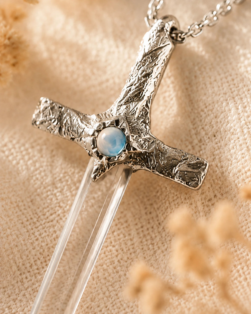 Close-up of handmade Lemurian quartz sword pendant showing natural crystal texture, silver-toned craftsmanship, and one-of-a-kind details.