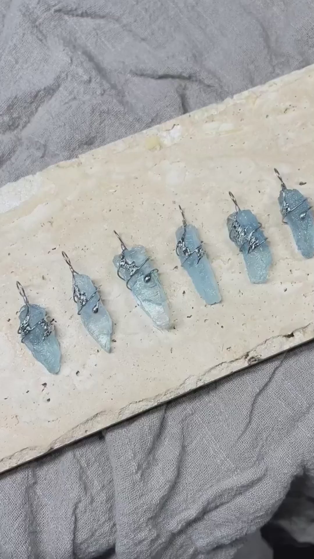 Video showing a handmade clear quartz soldered pendant necklace in natural light, with crystal texture, silver-tone details, and a calm clarity-inspired design.